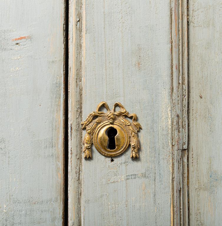 A late gustavian cabinet, circa 1800.