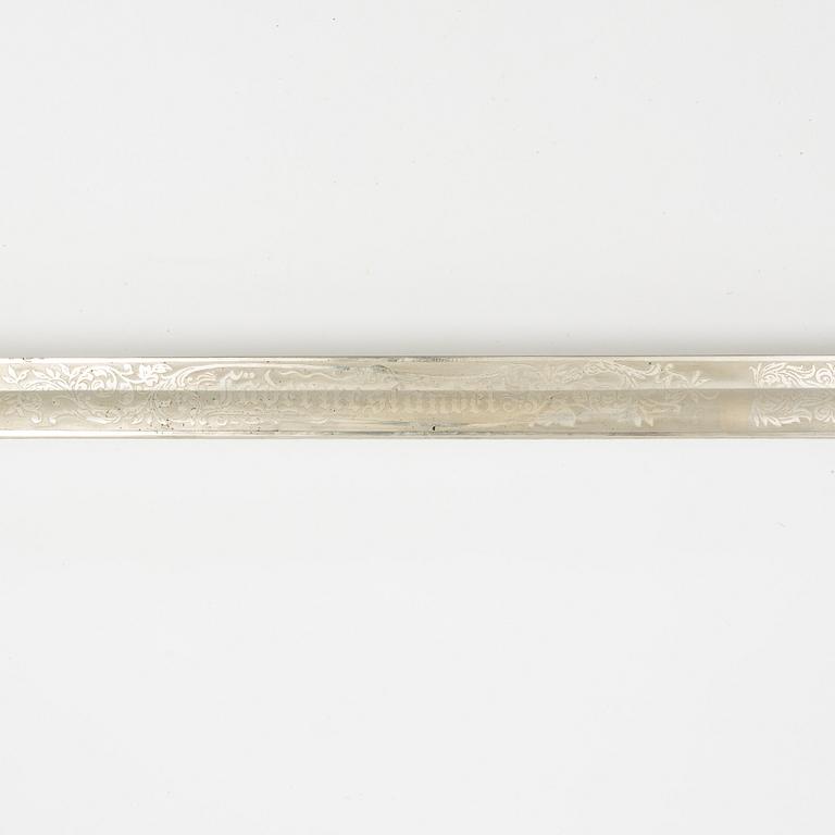 A Swedish naval officer's sword 1915 pattern with scabbard.