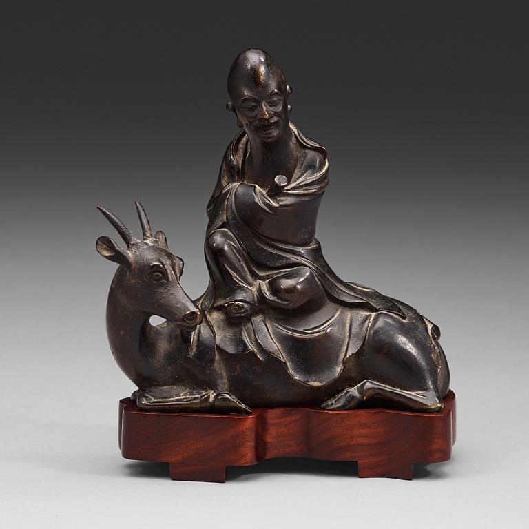 A bronze figure of Sholou on a reclining deer, Qing dynasty (1644-1912).