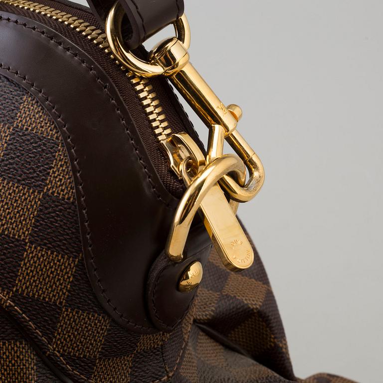 a LOUIS VUITTON 'Trevi GM' bag.