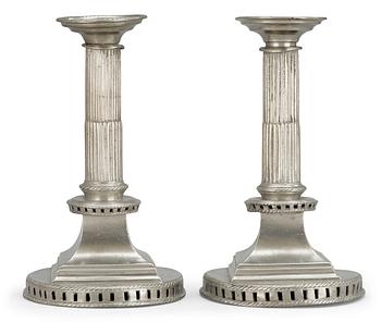 713. A pair of late Gustavian pewter candlesticks by G. F. Baumann.