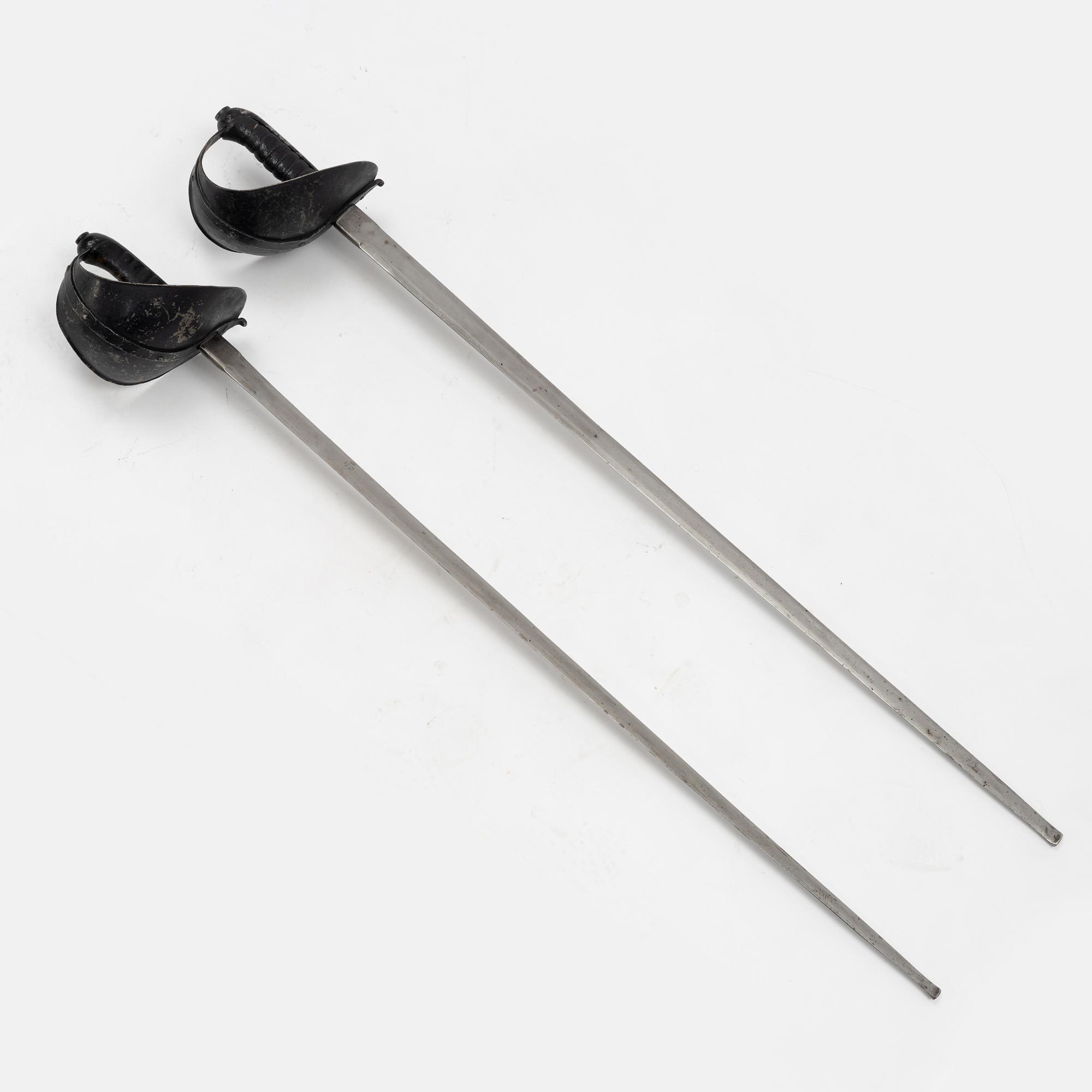 A Swedish pair of military practice swords 1886 pattern.