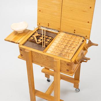 Magnus Ek, a oak wood praline trolley, Oaxen Krog, 2019.