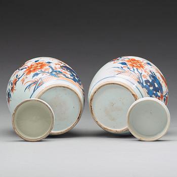 A pair of imari jars with covers, Qing dynasty, 18th Century.