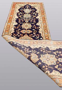 A Tabriz runner, so called Tabatabai, ca 402 x 97 cm.