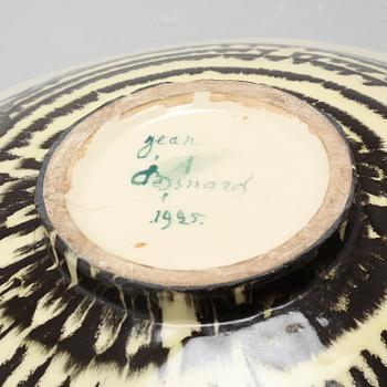 JEAN BESNARD, a glazed ceramic charger, France, signed and dated 1925.