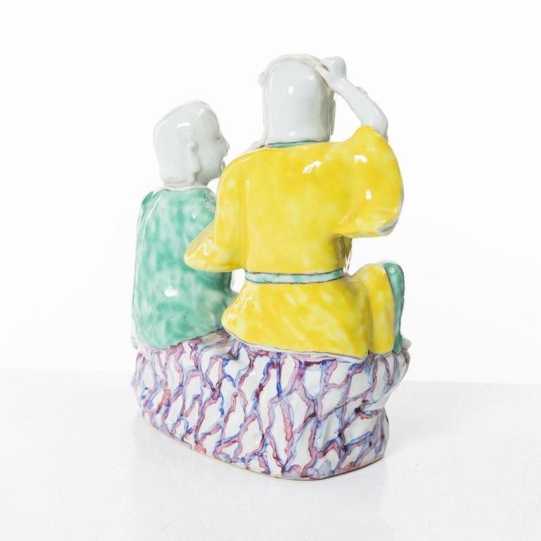 A Chinese porcelain figure group 'happy boys', Qing dynasty, 18th century.
