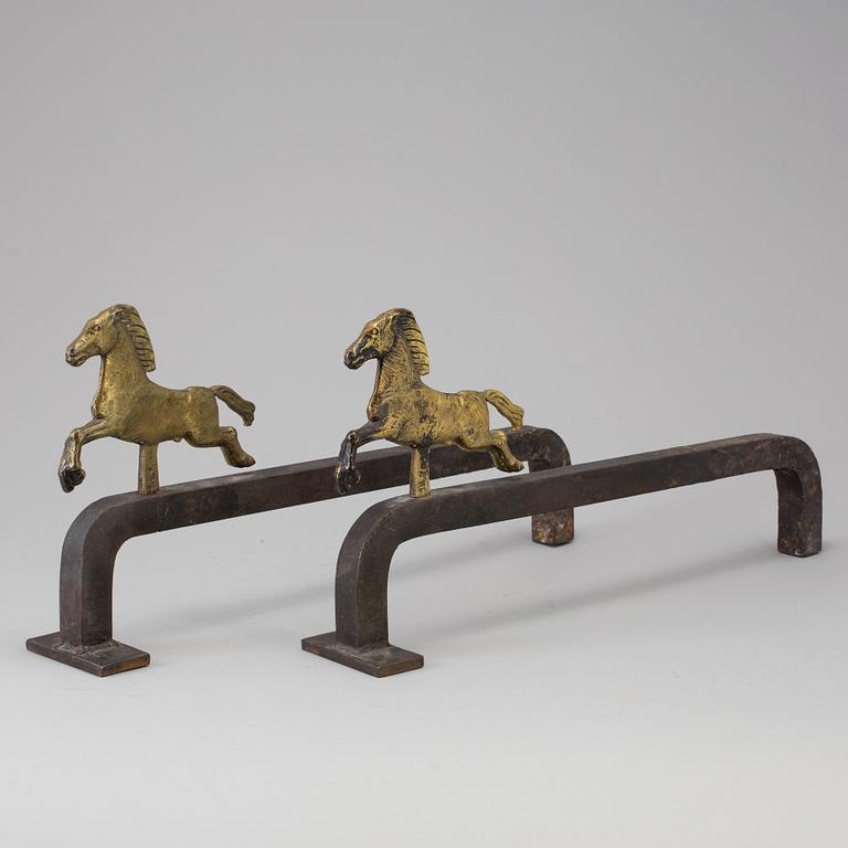 A PAIR OF IRON AND BRASS ANDIRONS by Tore Kullander, Borås 1943.