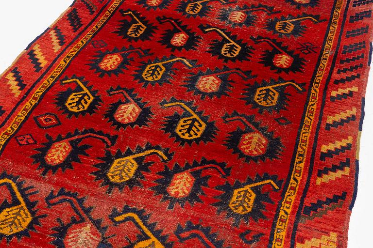An antique Central Asian carpet, possibly Kirghiz, c. 346 x 154 cm.