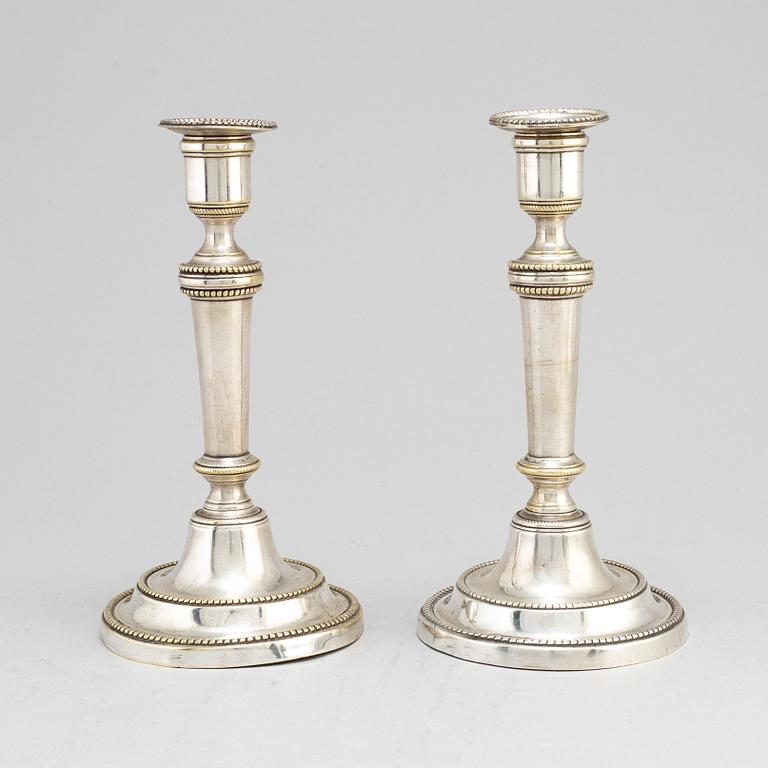 A pair of late 18th century/early 19th century plate candlesticks.