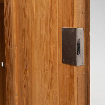 A pine cabinet, later part of the 19th Century.