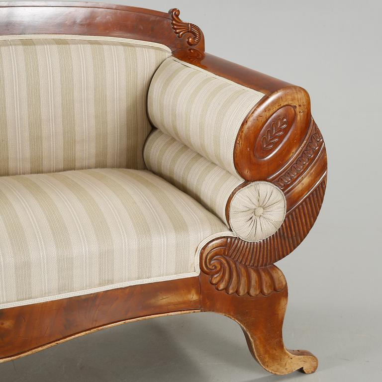 A late Empire sofa from the mid 19th century.