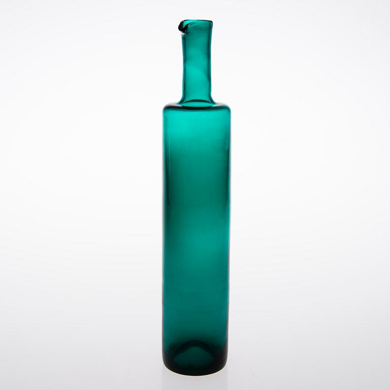 A glass bottle signed Nanny Still Riihimäen Lasi Oy.