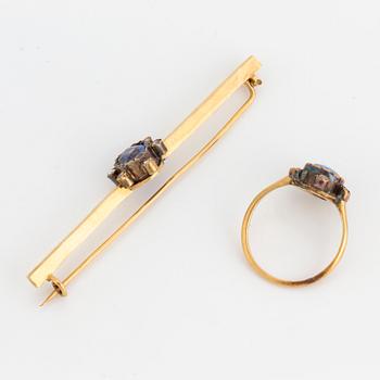 An 18K gold brooch and ring set with oval, mixed-cut sapphires and rose-cut diamonds.