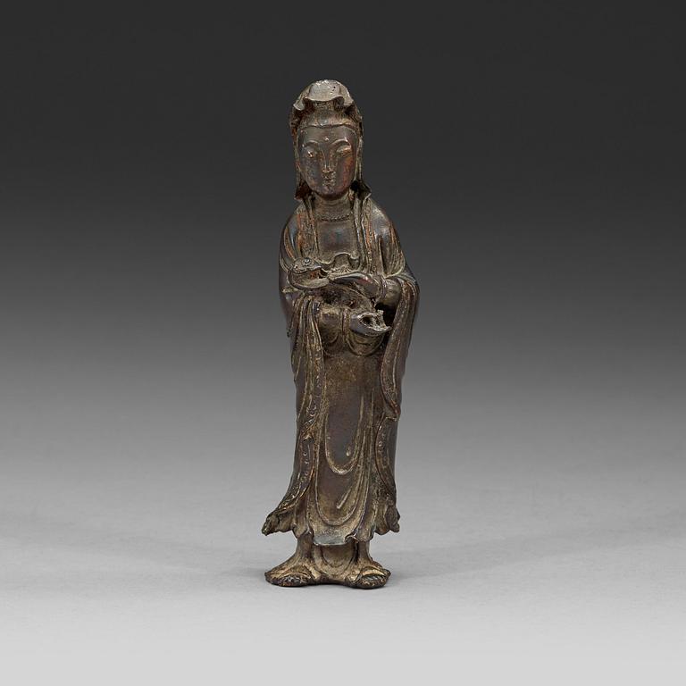 A bronze standing Guanyin holding a ruyi-scepter, Qing dynasty, 18th century.