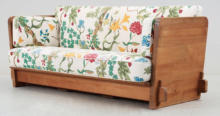 An Axel Einar Hjorth 'Lovö' stained pine sofa, Nordiska Kompaniet, 1930's.