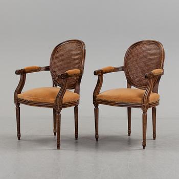 A pair of Gustavian style armchairs, second half of the 20th Century.