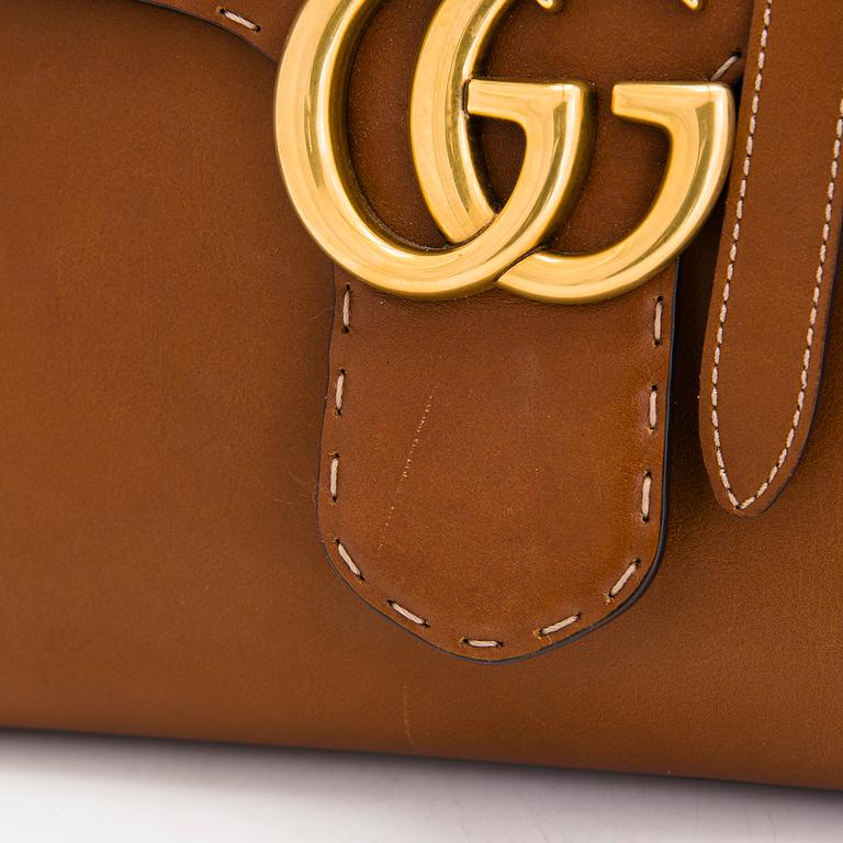 Gucci, a 'GG Marmont' leather bag.