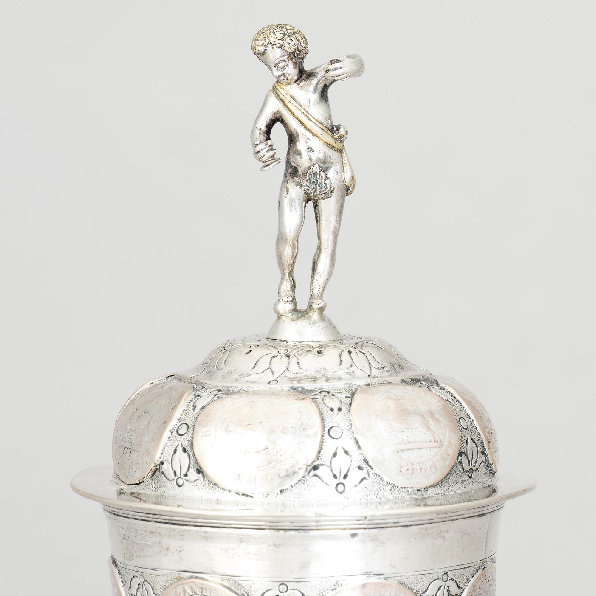 An 19th century parcel-gilt silver cup with lid, unidentified makers mark, probably Nürnberg.