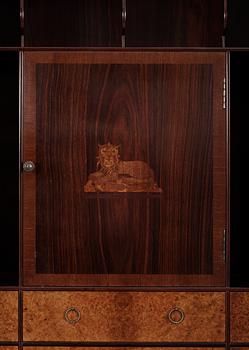 An Oscar Nilsson palisander cabinet on stand with stylized inlays, executed by  Wickman & Nybergs Möblerings- och Snickeriverkstad, Stockholm 1926.