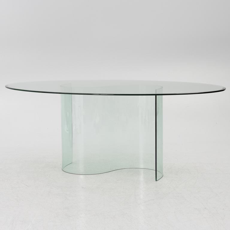 A dining table, glass, contemporary.