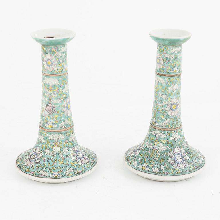 A pair of Chinese porcelain candle sticks, Qing dynasty, 19th century.