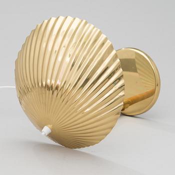 PAAVO TYNELL, A DESK LAMP. A shell.  Manufactured by Taito Oy. Designed in 1938/39.