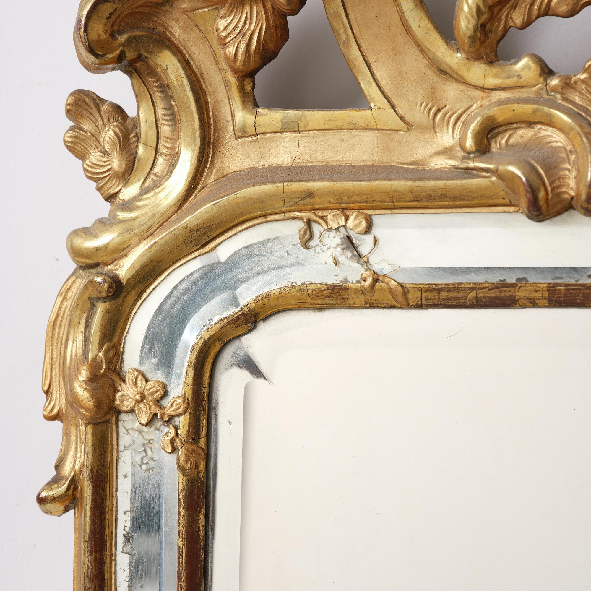A rococo giltwood mirror, Stockholm, later part 18th century.