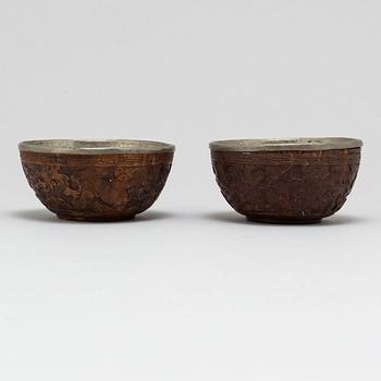 A pair of wooden bowls with pewter inlays, Qing dynasty, late 19th/early 20th century.