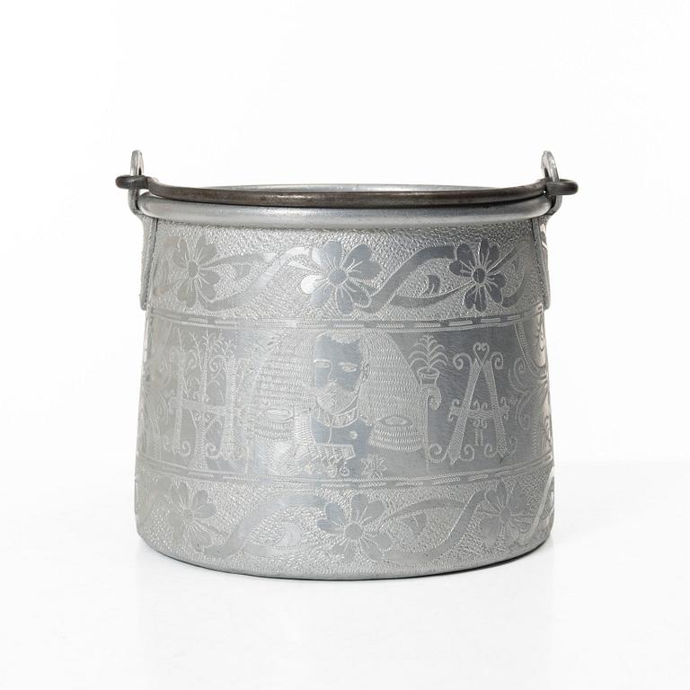 An aluminium bucket, a wooden case, four rings and two miniature knives, Finland and Russia, early 1900s.