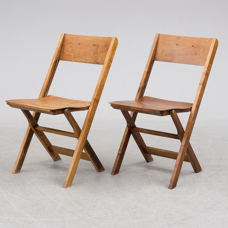 a set of 8 foldable chairs from the 1930's.