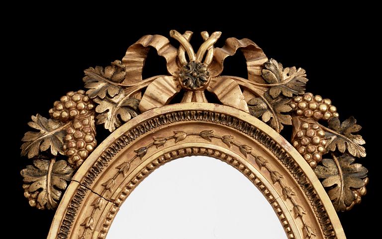 A pair of Swedish Empire early 19th century two-light girandole mirrors.