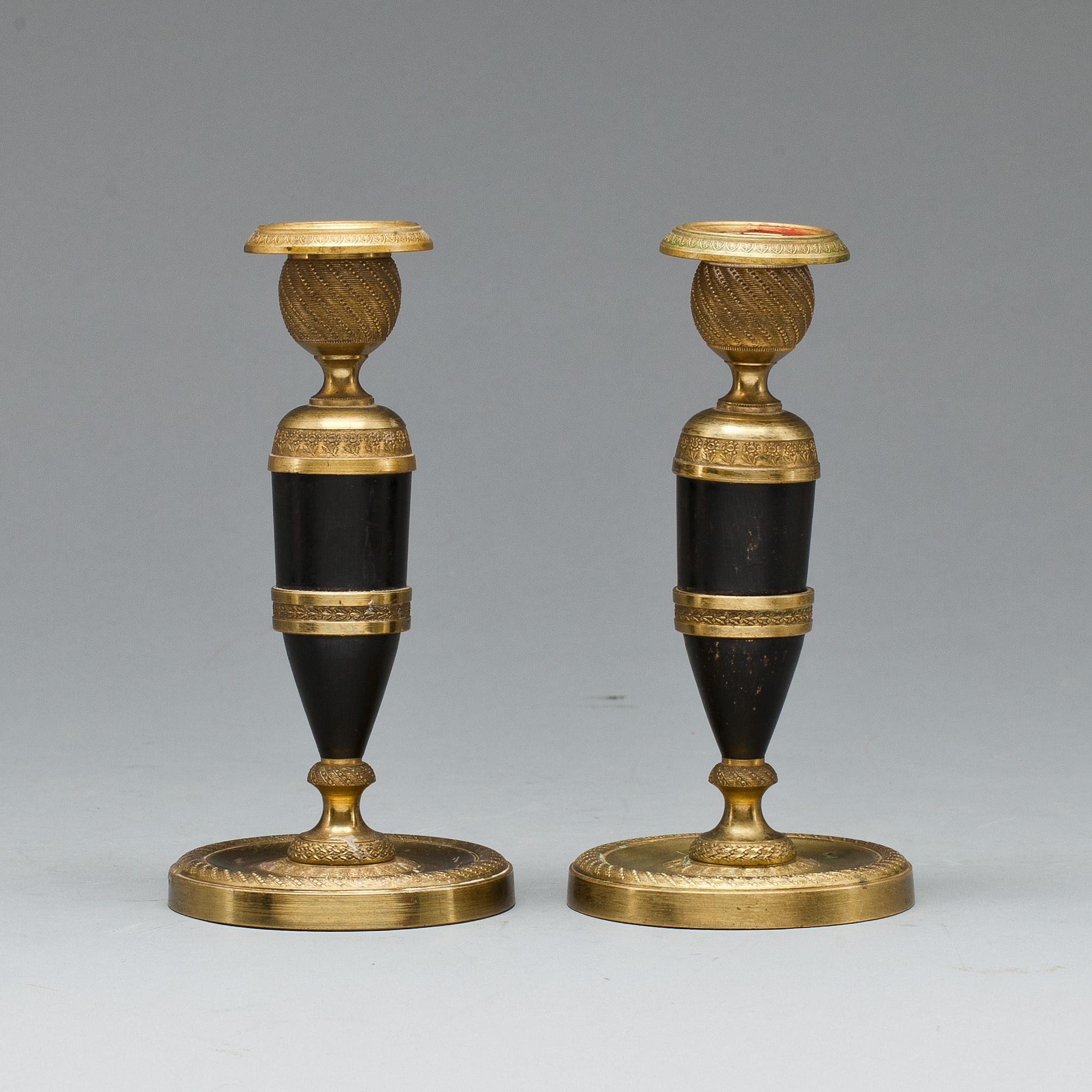 LJUSSTAKAR, ett par, empirestil. 1800-talets andra hälft, troligen Frankrike.