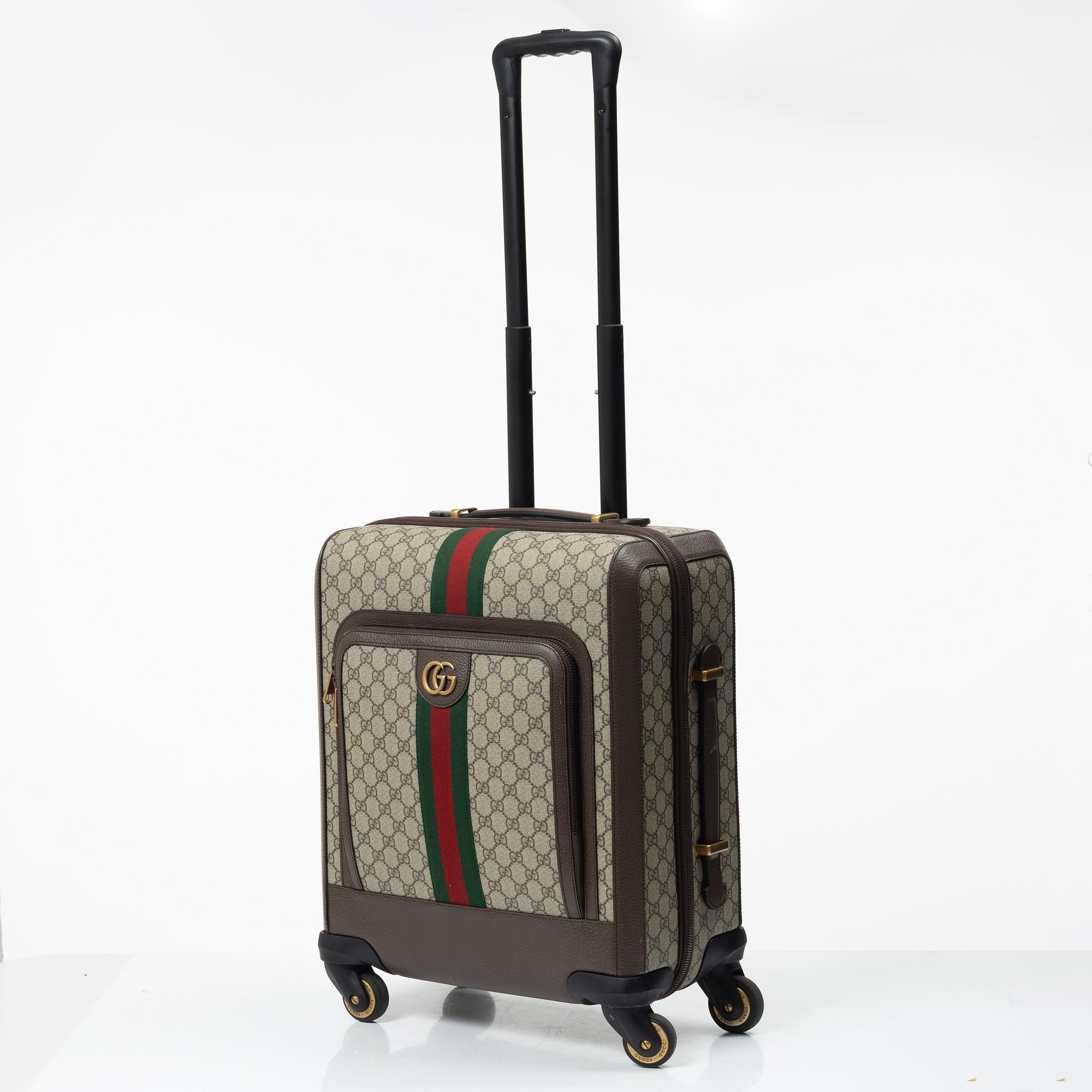 Gucci, suitcase / cabin bag.