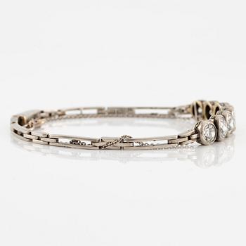 A bracelet in 14K white gold set with old-cut diamonds.