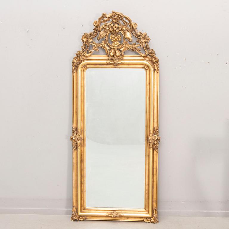 A bronzed Neo Rovovo mirror and table later part of the 19th century.
