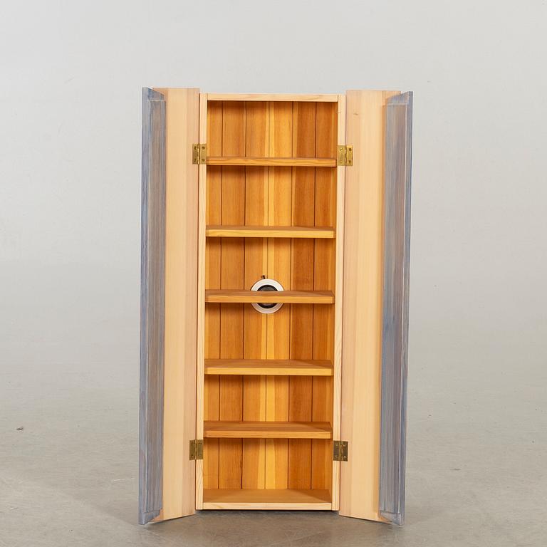 A wall cabinet "Blå ljus" design Olof Pira.