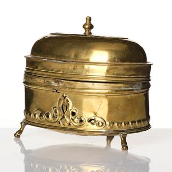 A baroque repousse brass pyxis, 18th century.