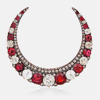 1031. A Victorian spinel and old-cut diamond crescent brooch. Rubies circa 8.50 cts and diamonds circa 10.00 cts in total.