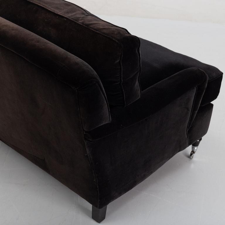 A contemporary velvet Howard sofa.