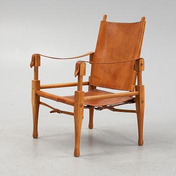 Scandianvian Modern, an oak and leather easy chair, mid 20th Century.