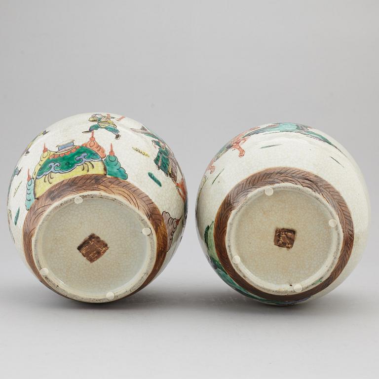 Two Chinese famille verte jars with wooden covers, first half of the 20th century.