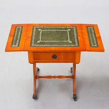 A pair of side tables width drop leaves from Schelco, end of the 20th Century.
