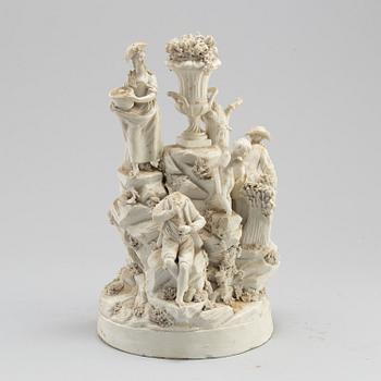 A porcelain figurine group circa 1900.