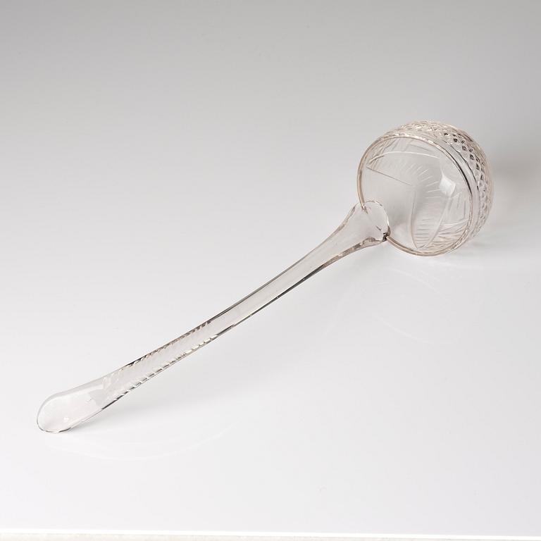 A cut glass punch bowl with cover, stand and ladle, Empire, first part of the 19th century.