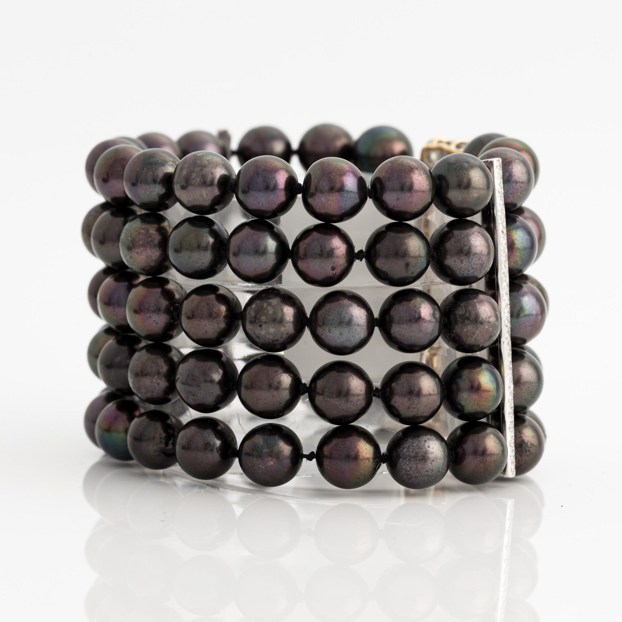 Bracelet and necklace, cultured black pearls, gold and white gold with brilliant-cut diamonds.