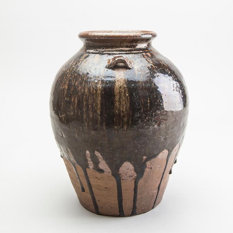 A South East Asian brown and black glazed jar, 14th/17th Century.