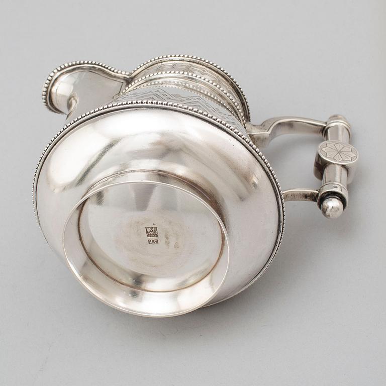 A Russian 19th century parcel-gilt silver tea pot and cream jug, mark possbly of Alexander Lokin, St. Petersburg 1893.