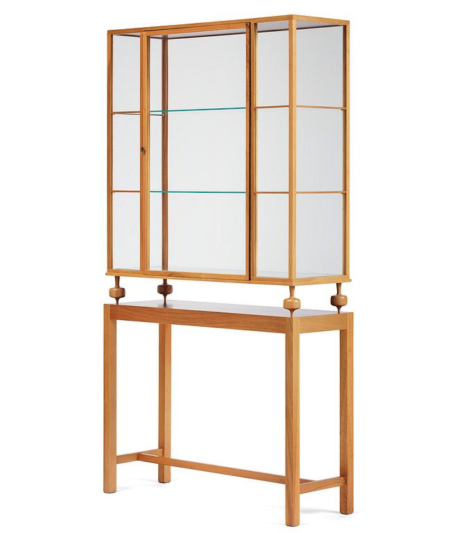 Josef Frank, a walnut showcase cabinet model "B 2077", Firma Svenskt Tenn.