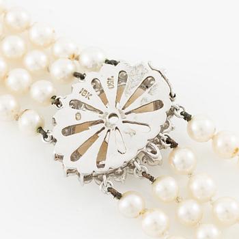 Necklace, four-row with cultured pearls, clasp 18K white gold set with opal and brilliant-cut diamonds.